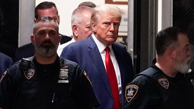 Donald Trump silent as he enters courtroom before pleading not guilty for fraud