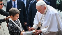 Pope Francis signs young boy’s cast as he leaves hospital after three-day stay