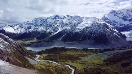 Shot of Shallow Stream Flowing from Glacial Lake and Running Through Green - 4K