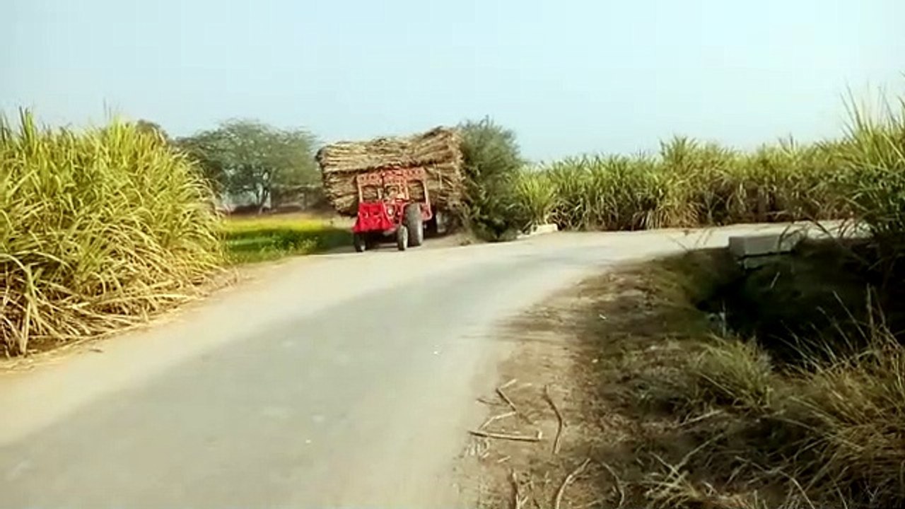 Tractor pulling heavy trolly