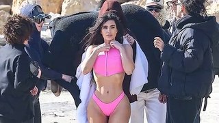 Kim Kardashian bares her whole booty in bubblegum pink thong bikini