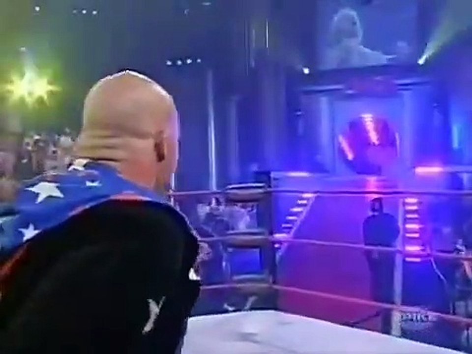 Angle attacks the ring announcer and confronts Jarrett