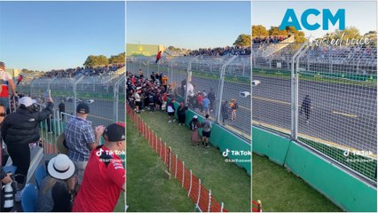 Melbourne Formula One fans enter track during Grand Prix