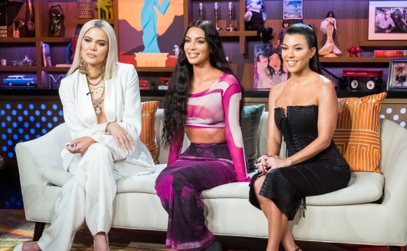 Kim Kardashian Wore a Gigantic Pink Faux Fur Coat While Playfully Trolling Khloé and Kourtney