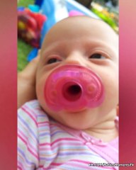 Cute Baby Playing With Pacifier