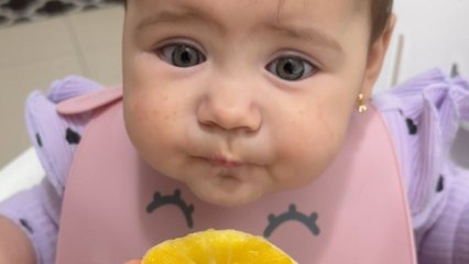 Adorable baby tries orange for the 1st time and she has mixed peelings about it