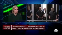 Donald Trump enters New York City courtroom following arrest processing