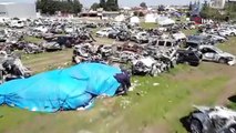 Hatay'da enkazdan çıkarılan binlerce araç mezarlığı andırıyor