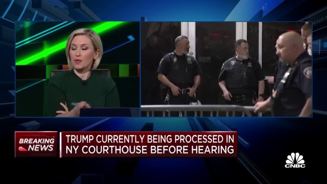 Donald Trump enters New York City courtroom following arrest processing