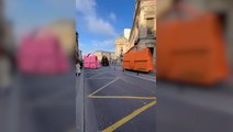 Giant Jacquemus bags roll down Paris street
