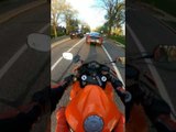 Biker Crashes Into Car and Falls Down