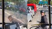 Cyclist smashes the window of a bus in horrifying road rage attack