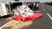 A vehicle full of grains overturned on the National Highway
