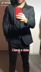 Gatita ayuda a su amo a verse espectacular antes de una cita romántica.