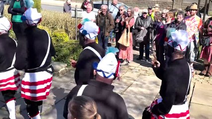 Controversial Morris dancers who black up their faces perform in English village