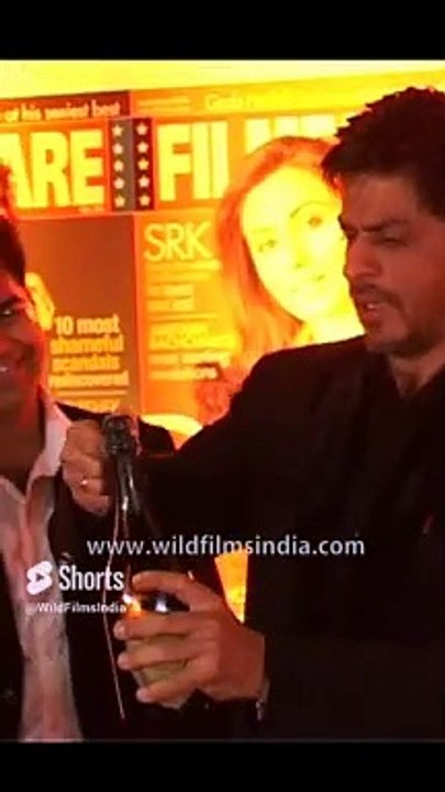 Shah Rukh Khan struggles to open a Champagne bottle