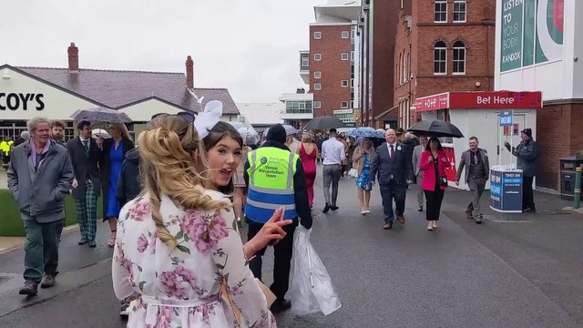 Glamourous racegoers have braved the rain to flock to Aintree racecourse for the Grand National Festival's Ladies Day