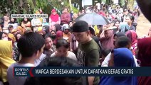 Warga Berdesakan Untuk Dapatkan Beras Gratis