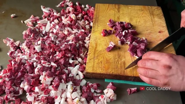 Uzbek SNAKE_ Shaped MEAT in Tandoor. TRADITIONAL Street Food. Uzbek Cuisine