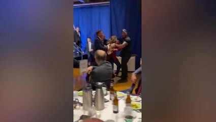 Moment protesters run on stage to disrupt Ron DeSantis speech