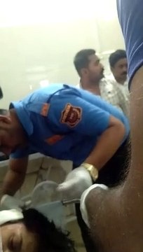 Security personnel treating the injured