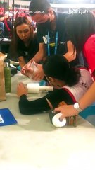 UE team captain Ja Lana being treated after spraining her right wrist in Set 2 versus Adamson