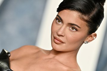 Kylie Jenner Wore a Sheer White Crop Top With a High-Slit Denim Skirt to Coachella