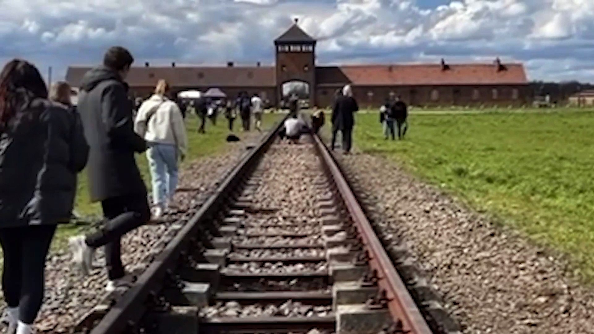 New footage shows woman setting up her controversial posed shot outside Auschwitz