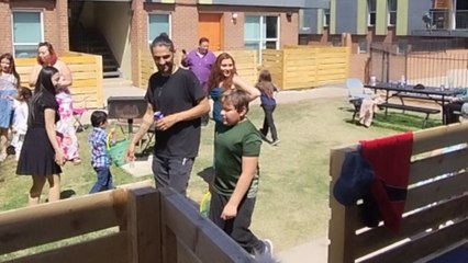 Curious kids turn into treasure hunters as they search for Easter Eggs in the yard