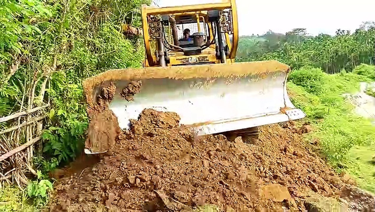 Today D6R XL Bulldozer Repairs Landslide Road in Reservoir