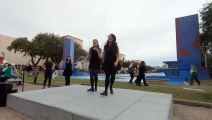 Irish River Dancing Girl's dancing in the public street in front of public.