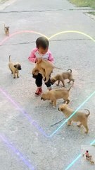 Cute baby playing with cute puppy