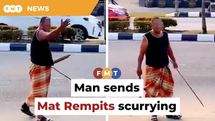 Man brandishing sticks drives away noisy Mat Rempits