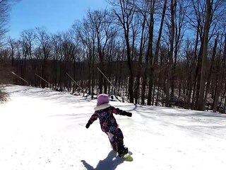 5-Year-Old Goofs Around While Snowboarding With Dad