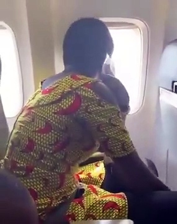 Look how scared is this lady travelling by plan...