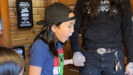 Grateful kid starts bubbling with excitement after parents surprise him with a fish tank