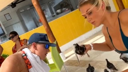 Woman is SUPER PROUD of herself after impressing friends by snatching up a bird from the floor