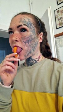 Woman Grabs Carrot With Her Split Tongue