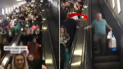Metrodaki kalabalığa girmek istemeyen vatandaş, yürüyen merdivenlere ters yönden bindi
