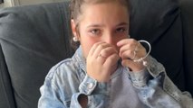 Girl is moved to tears after being surprised with a bangle containing her late sister's ashes