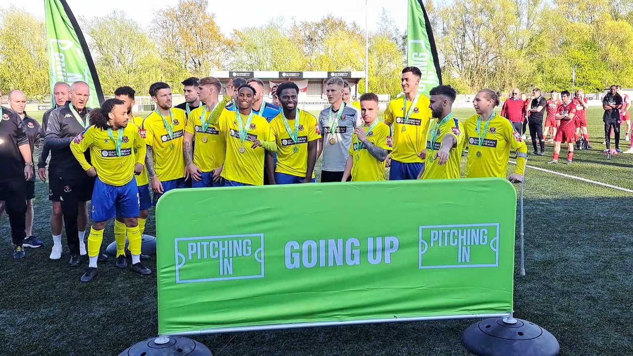 AFC Sudbury celebrate promotion by lifting the Isthmian League North Division Play-Off Final Trophy