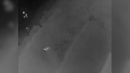 Police wade into freezing sea to save life of woman