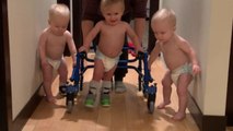 Tender-hearted boys stick by their triplet brother's side as he learns to walk using his posterior walker