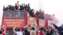 Wrexham players celebrate promotion with open-top bus parade through city