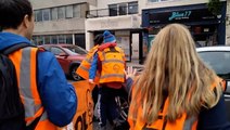 Moment motorist drives through Just Stop Oil protesters blocking road