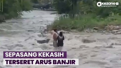 Video herunterladen: Menegangkan! Detik-Detik Sepasang Kekasih Terseret Banjir Bandang di Medan