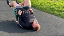 Man finds himself hilariously stuck in a spring seat rocker at a children's playground