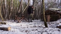 hiding in a huge dugout during a snow storm, spending the night in  bushcraft shelter