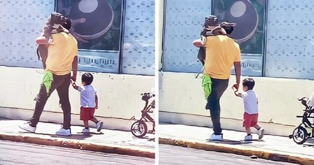En choisissant de porter son chien plutôt que son fils, cet homme s'est attiré la sympathie d'un grand nombre d'internautes