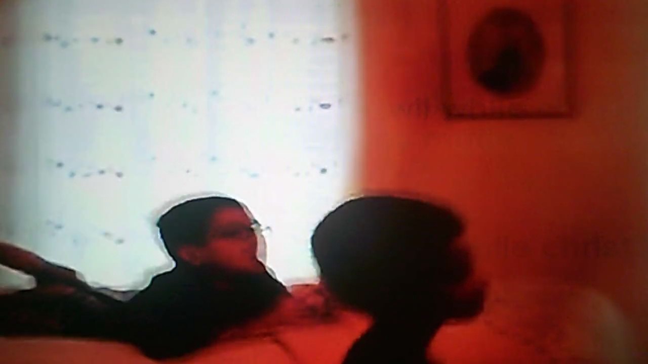 Christopher plays the wii while Jonathan watches